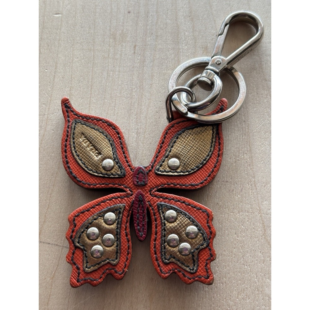 Prada Butterfly Keychain Bag Phone Charm Orange Gold Leather Studded